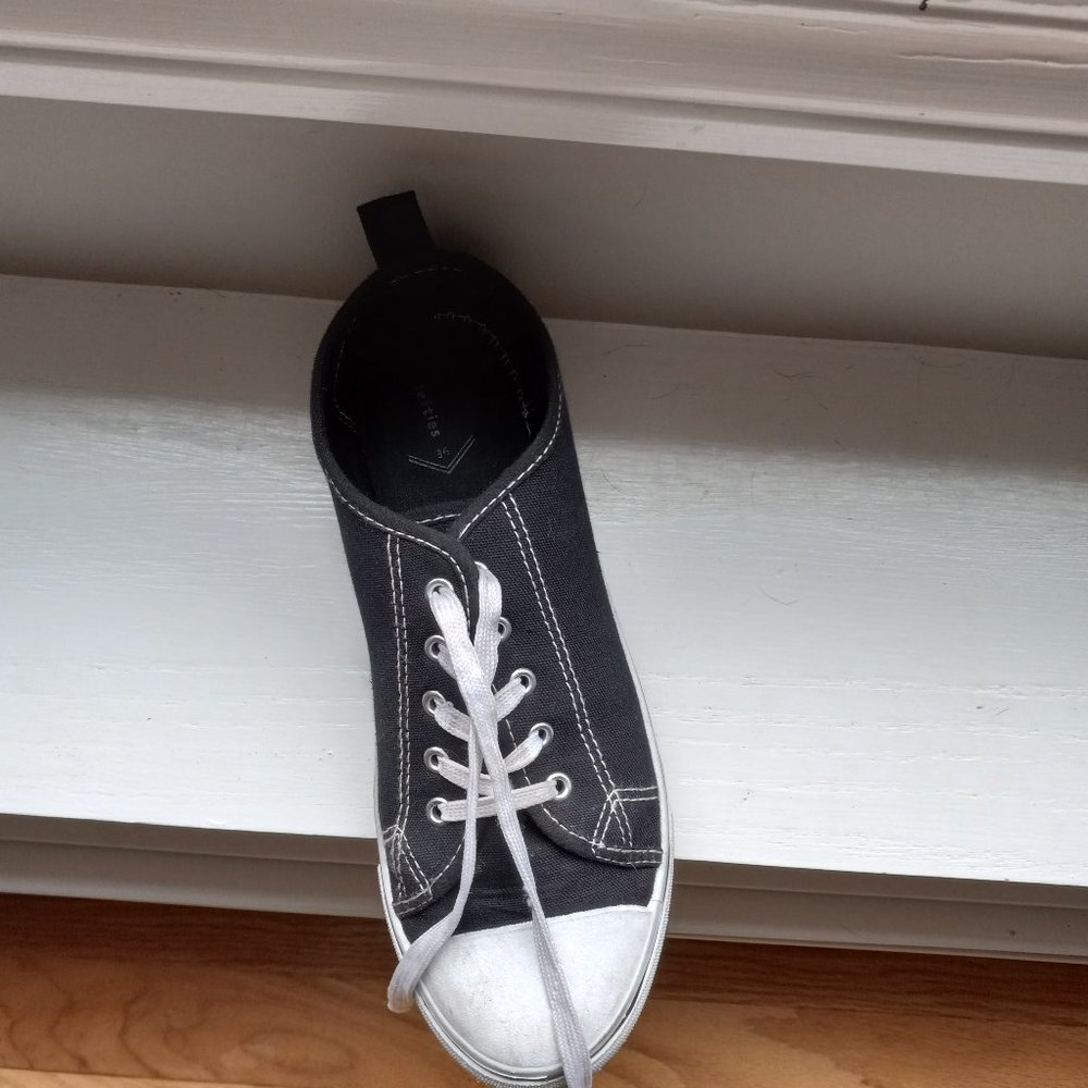Black and white lefties shoes